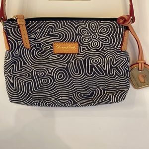 Dooney and Bourke crossbody navy and white, tan strap, hot pink accents.